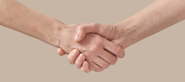 Two men handshake agreement or greeting gesture, sign helping hand of a friend isolated on beige background. Image by Yaroslav Danylchenko on Freepik